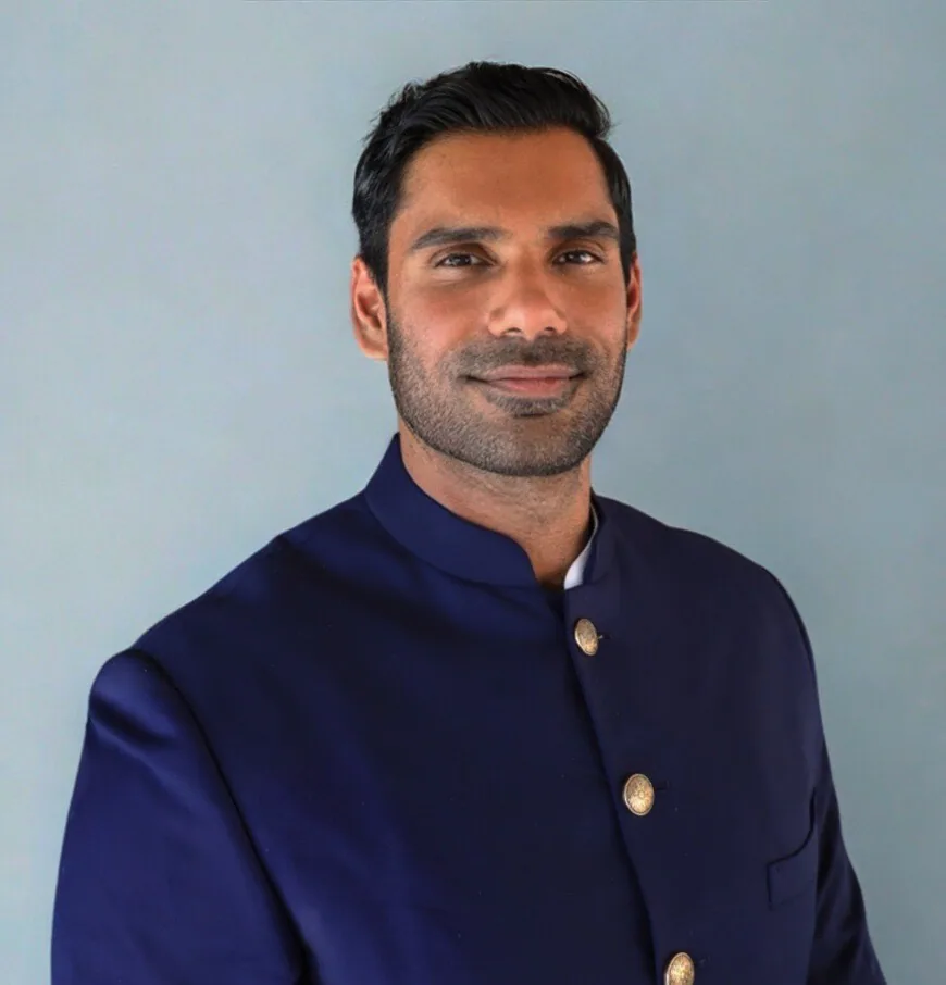 Portrait of Neel Jaiswal wearing a navy jacket.